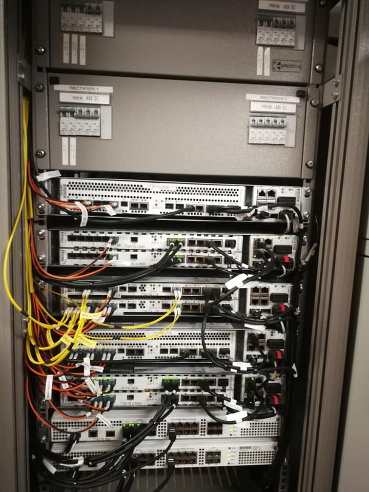 Technician at an equipment cabinet