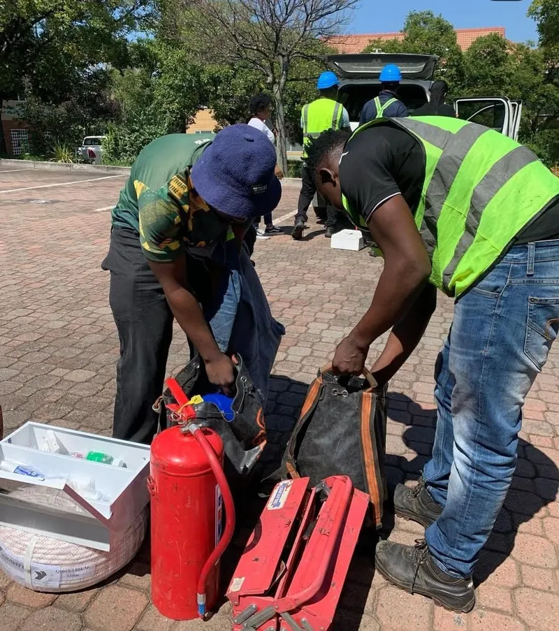 Crew preparing tools and safety equipment